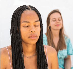 Two woman meditating image